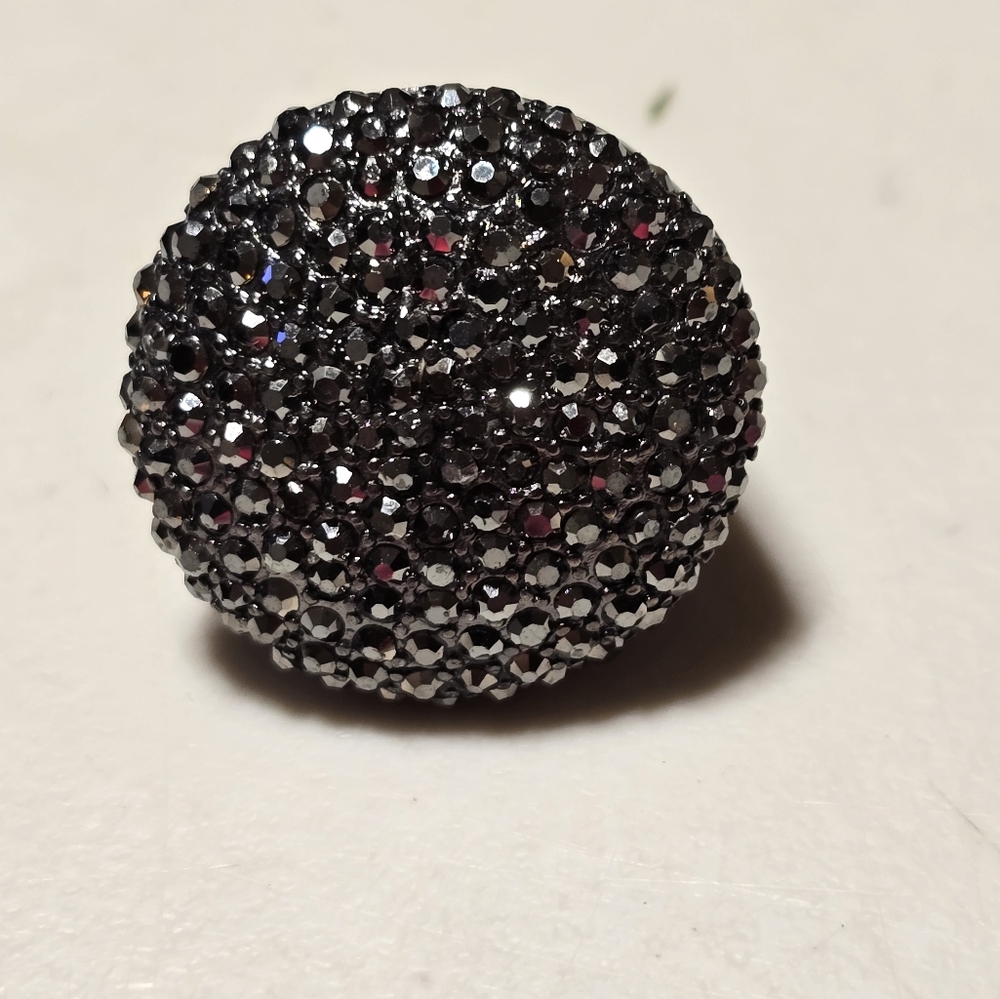 Chunky Black Metal Decorated with Small Rhinestones.